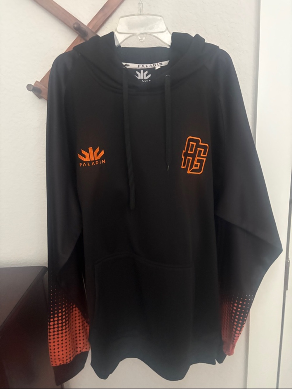 Paladin Black Hoodie with Orange Logo. Never worn with Tags On